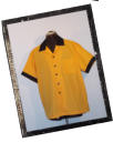 Our classic 1950's design is made of a poly/cotton blend and has contrast buttons, cuffs and collar. Available in our shop.